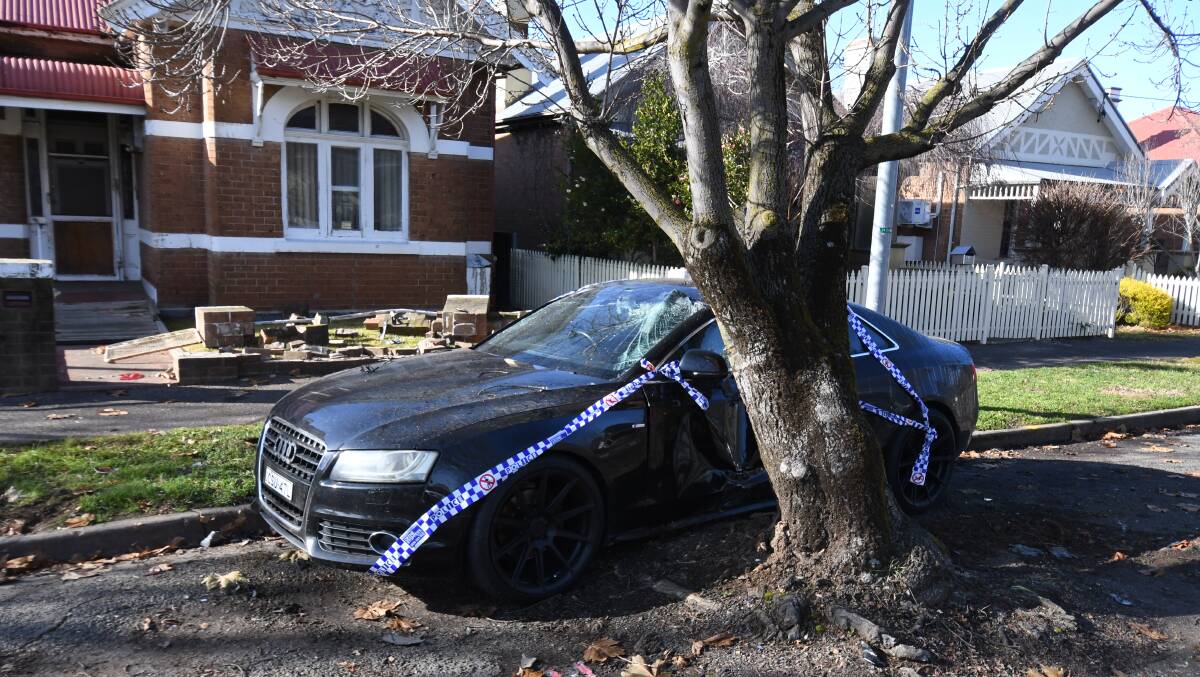DAMAGE: A late model Audi and the front fence of a Hill Street home were damaged in the early hours of Saturday morning. 