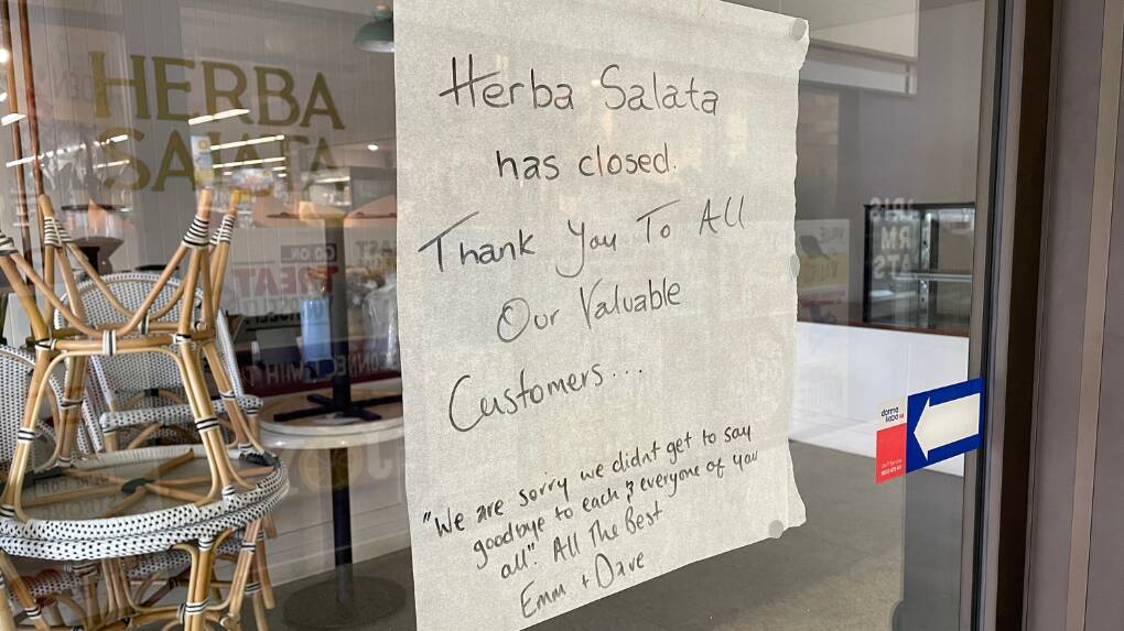 A sign on the shopfront window from Emma and Dave Engelman indicating Orange's Herba Salata store closure. Picture by Riley Krause.