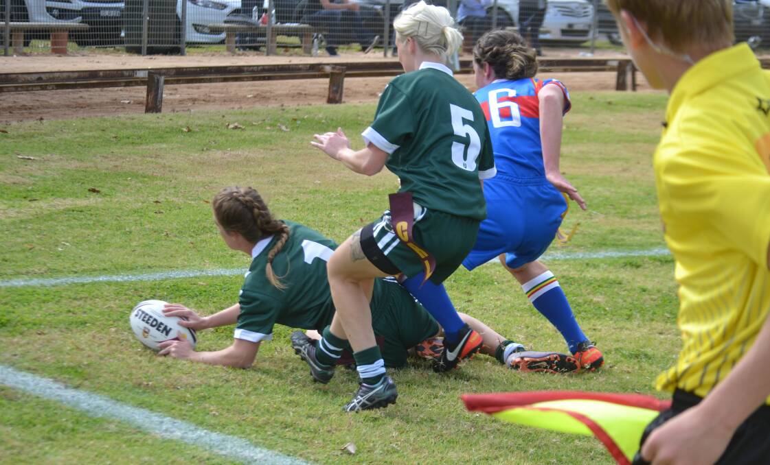 SHE'S OVER: Blayney's Sophie Stammers plants the ball for Western Rams' first try in their League Tag Country Championships win over Monaro. Photo: PETER GUTHRIE