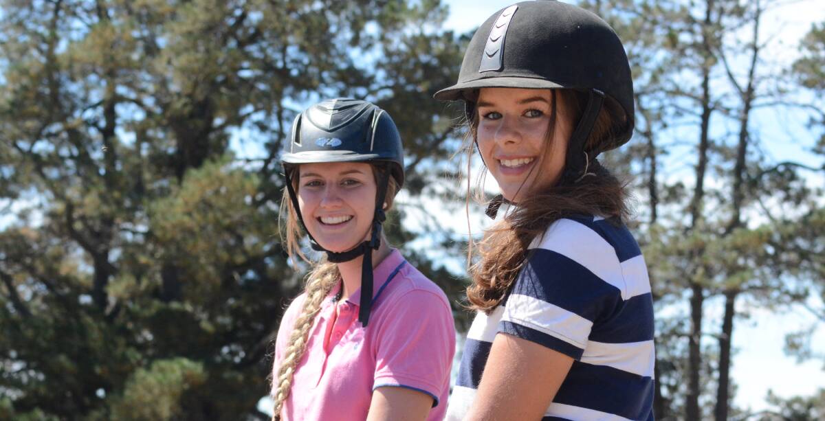 Riding high: Kate Redmond and Emma Bright took part in the equestrian events during the Neville Show.