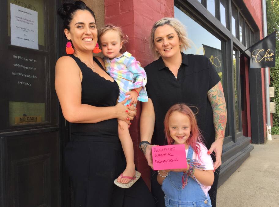 Great idea: Julia Skovgaard and Jess Cooper with Arliyah and Maleigha Richardson who popped into the store to make a donation. 