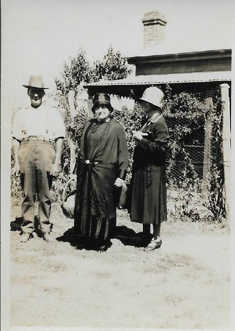 Emma Simons (Centre) at Christmas 1930, with two unknown family members outside the family home at 33 Mount McDonald Rd, Lyndhurst. Photo: Contributed.