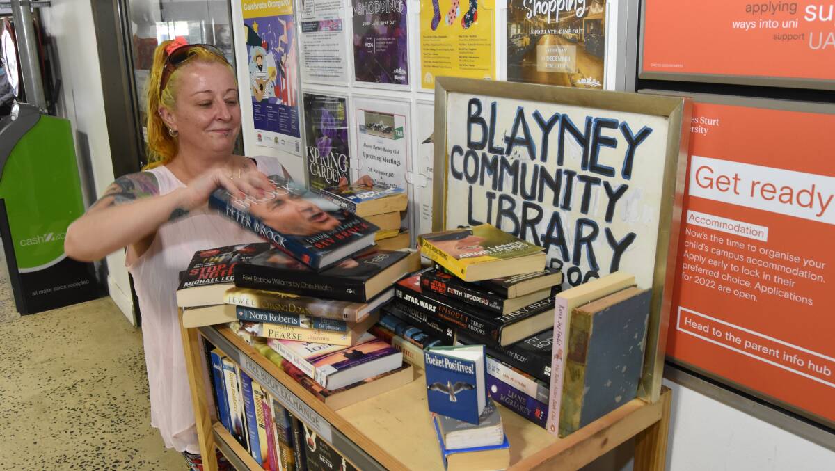 STACKING IT UP: Sam Hawkins has commenced Blayney's first community library bookstall. Photo: Mark Logan.