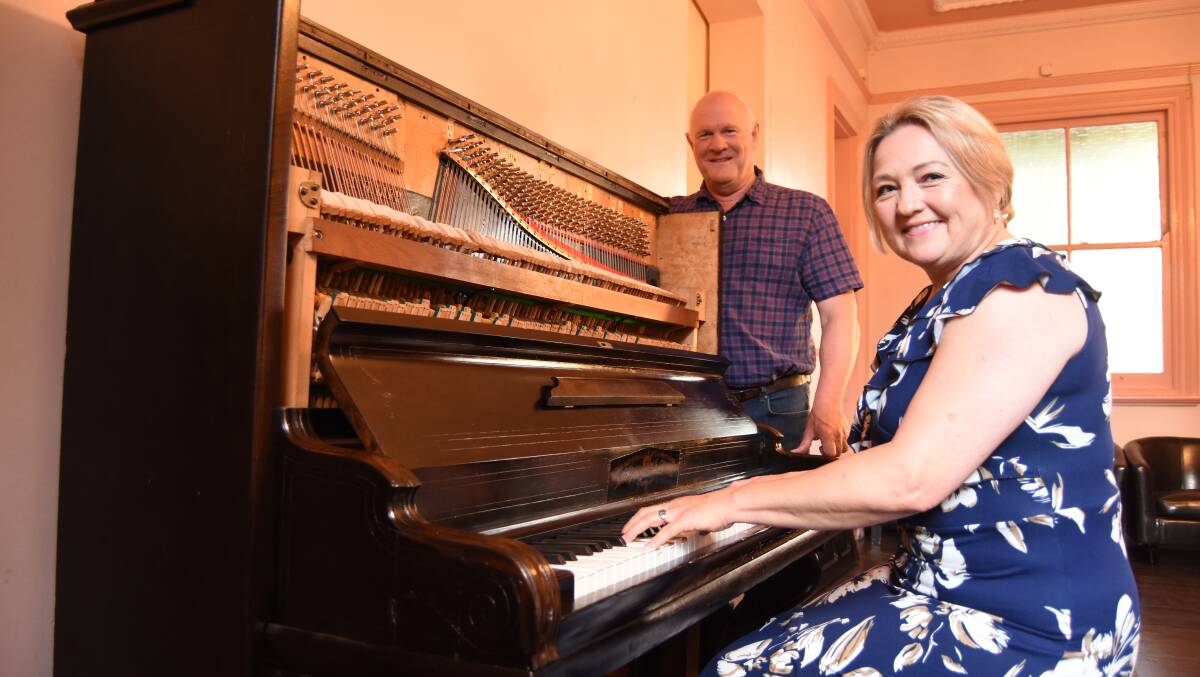 Ebony and Ivory: Kobus and Sonette Vermaak with the 1860's German made piano that Sonette has been restoring. Photo: Mark Logan.
