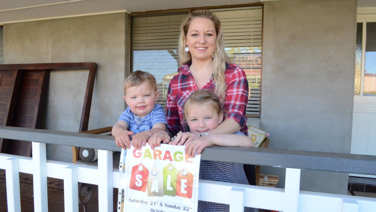 Sale of the Century: Skye Nicholson, with Gryffyn and Isobelle Weber, will have plenty of kids' clothing, toys and furniture at her Garage Sale in Millthorpe this weekend. Photo: Mark Logan.