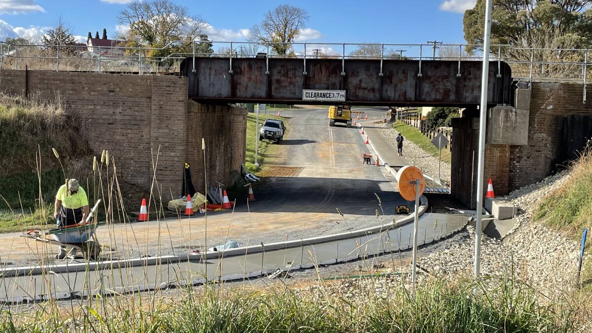 COMING ALONG: The new footpath and kerbing is almost complete under the rail bridge. Photo: Charlie Dunn.