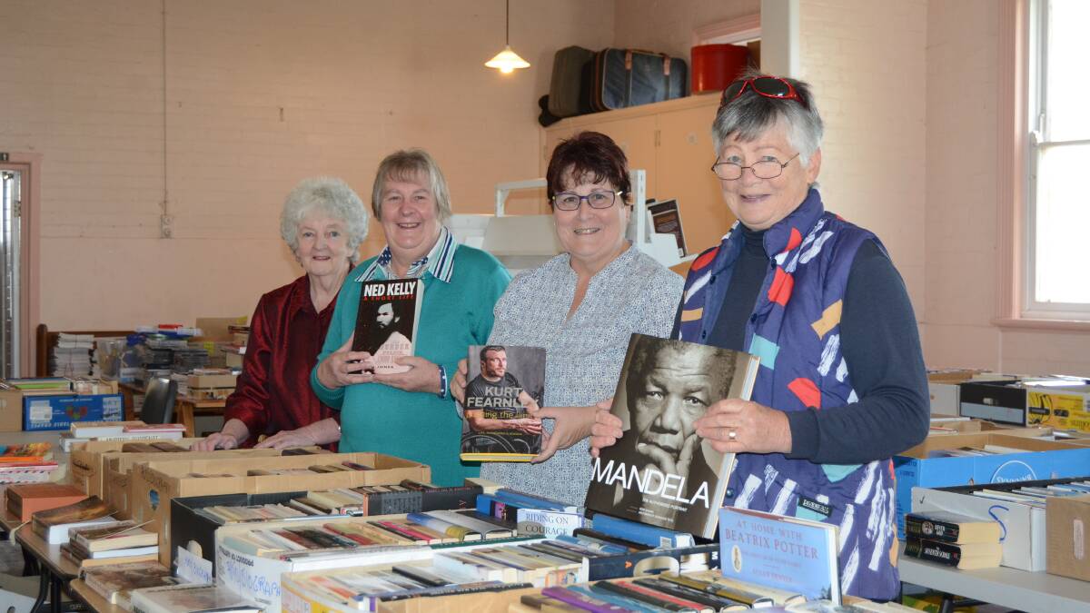 Booked up: Book fair volunteers Decima Cove, Elizabeth Russ, Sue Lane and Gillian Haylan have been busy setting up for this year's book fair.