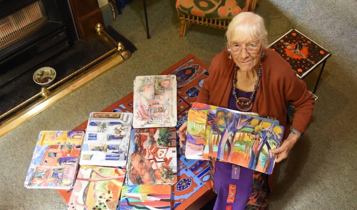 COLOURFUL LIFE: Ada Clark with some of the placemats that she said sell in the thousands. Photo: Mark Logan.