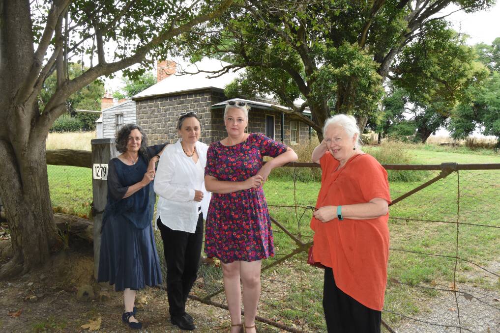 ISOLATED: Jenny Beach, Helen Russ, Mary-Liz Andrews and Anne Harrison in front of the historic bluestone cottage on Park Street. The new development will be in behind the cottage. Photo: Mark Logan.
