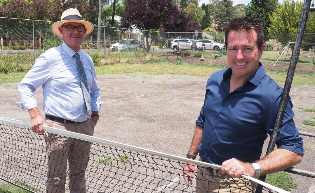Aced: Allan Ewin and Paul Toole at the Carcoar tennis court which is set to be given a total revamp thanks to funding of nearly $16,000. Photo: Contributed.