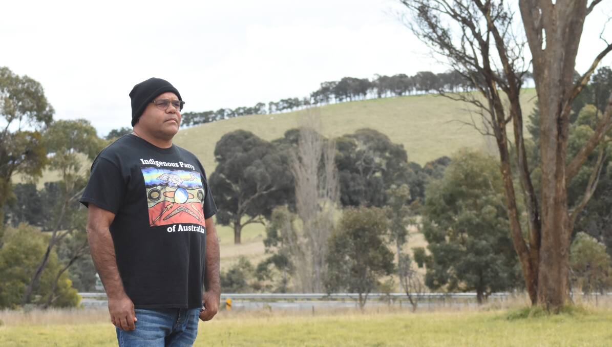 SACRED: Uncle Owen Whyman is calling on the Environment Minister, Susan Ley to stop the McPhillamy's Gold Project to be constructed in the area in the background.