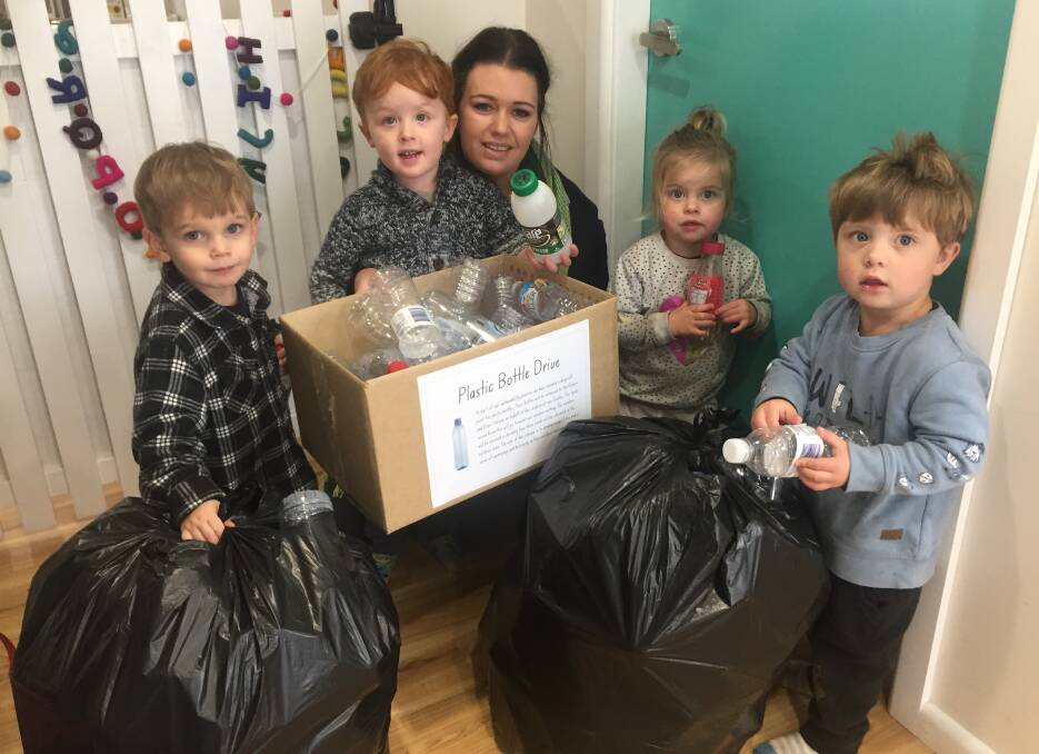 Plastic fantastic: Educator Corinne McCormick with children Harrison Hewitt, Sonny and Coco Hodder and Blake Evans. Photo: Contributed.