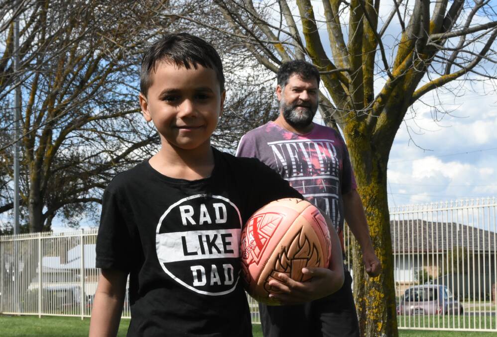Ready to play: Zane Bennett with Dean Lettice is ready to get involved in a new touch football competition, but help is needed to secure inexpensive insurance. Photo: Mark Logan.