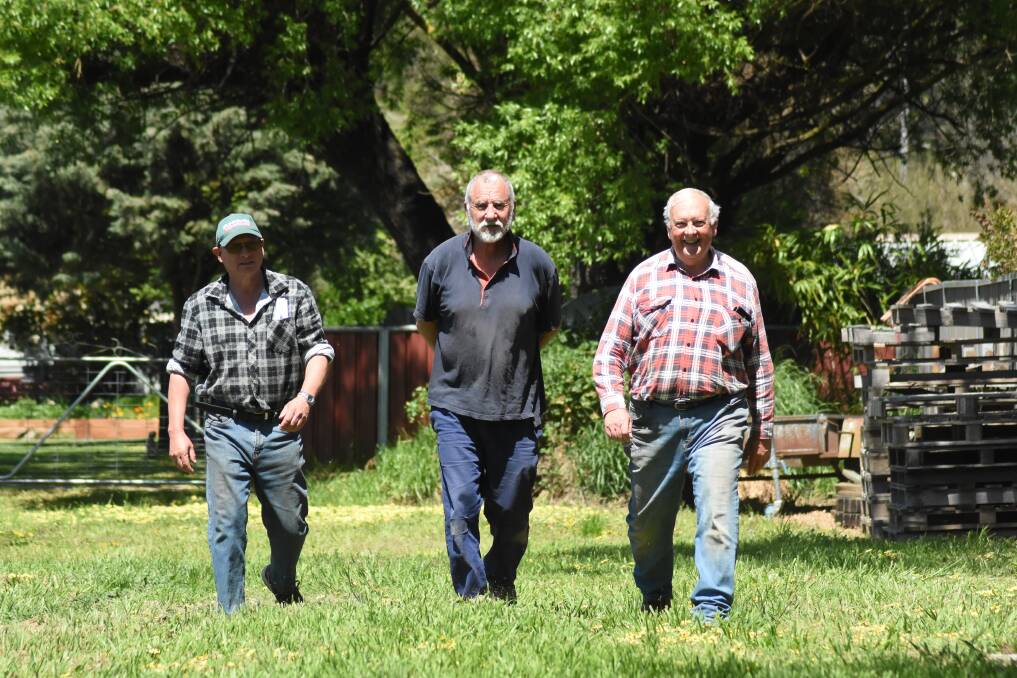 Walkie talkies: Daryl Hildebrandt, Paul Mulholland and Ian Tooke take to the streets of Blayney every Sunday morning.