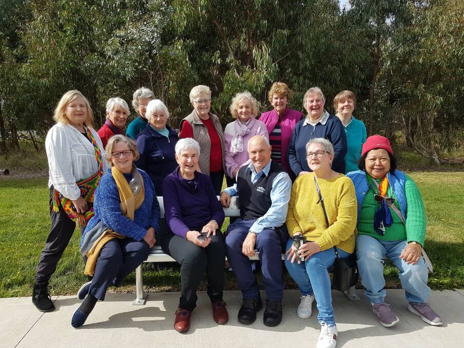 Members of the Inner Wheel Club of Blayney with Brian Parker on the Friendship seat.
Photo: Contributed