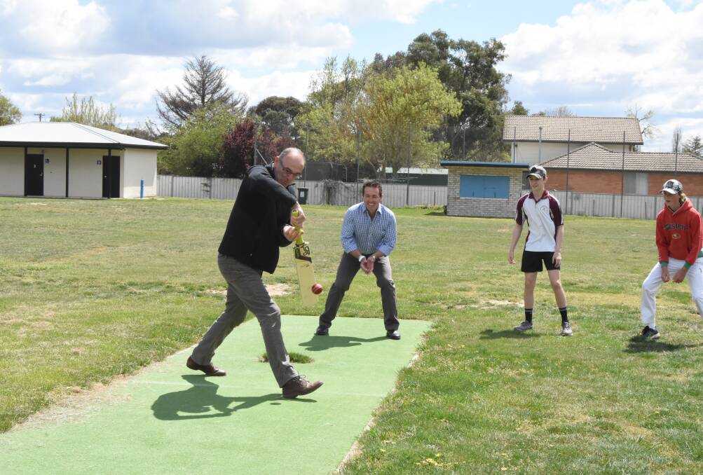 How is he?: Scott Ferguson gets an edge to Paul Toole, Harry Taylor and Cooper Grenfell on the old cricket pitch at Napier Oval. Photo: Mark Logan.