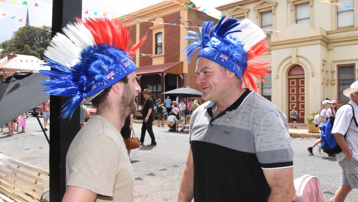 In the spirit: Kirk Phillips and John Tracey will have to wait until 2022 for a chance to wear their patriotic Mohawks again. Photo: Mark Logan.