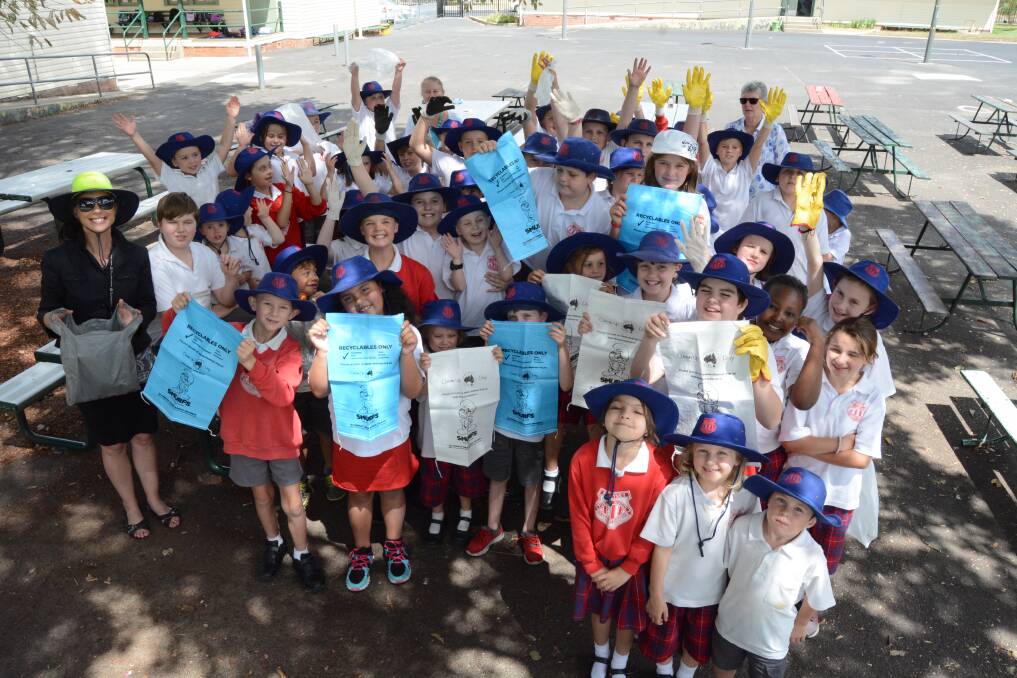 Bagging it up: Blayney Public School students are taking to the school and surrounding areas for Clean Up Australia Day. Photo: Mark Logan