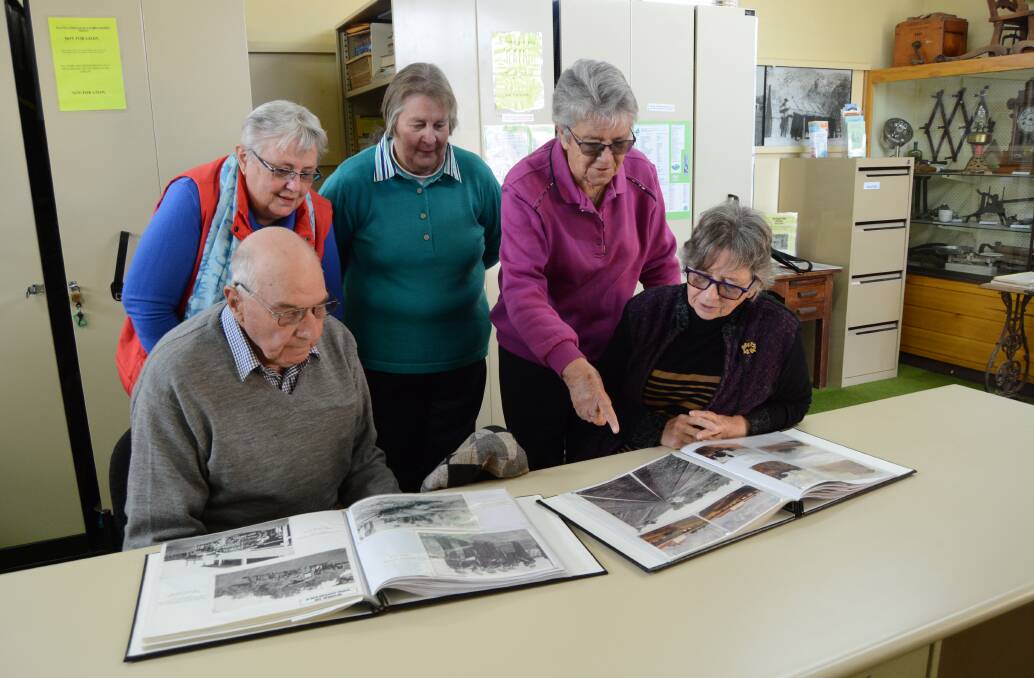 Pointed history: Norm Stonestreet, Rhonda Jones, Elizabeth Russ, Helen Dent and Elizabeth Tooke with some of the images that have been scanned by the group.