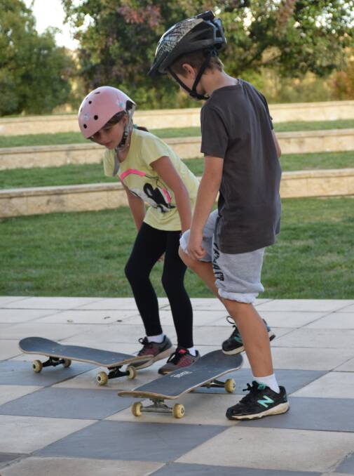 Balancing act: Lilly Ashfield and Jayden Dobson took part in the Skateboard workshop at Heritage Park. Photo: Margaret Paton