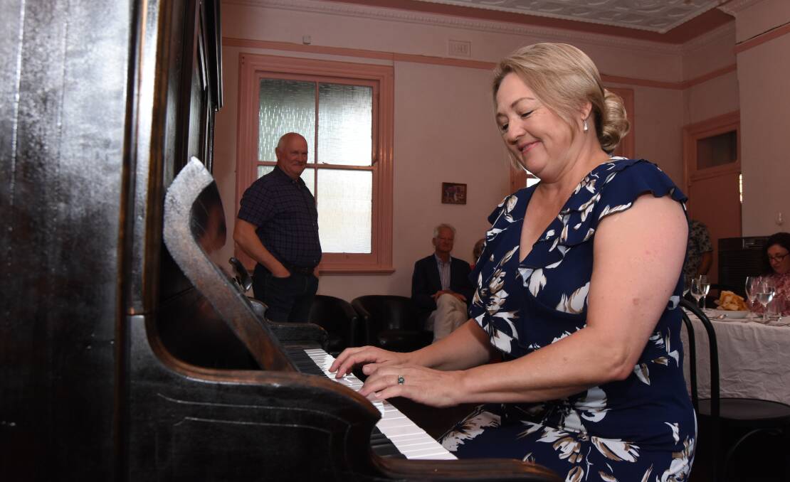 DEFT AT HAND: Sonette Vermaak on the piano that she has restored in the Grand Western Lodge.