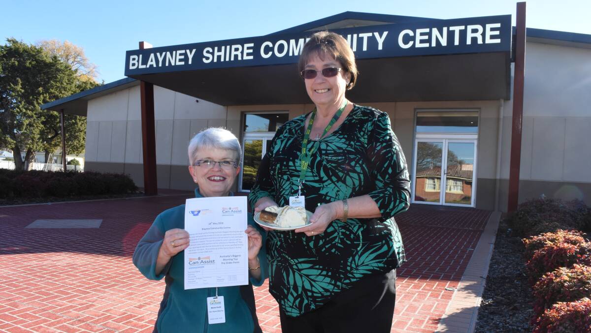 Great idea: Maree Smith and Sue Scott with a plate of goodies and the order form to get your big morning tea delivered. Photo: Mark Logan.