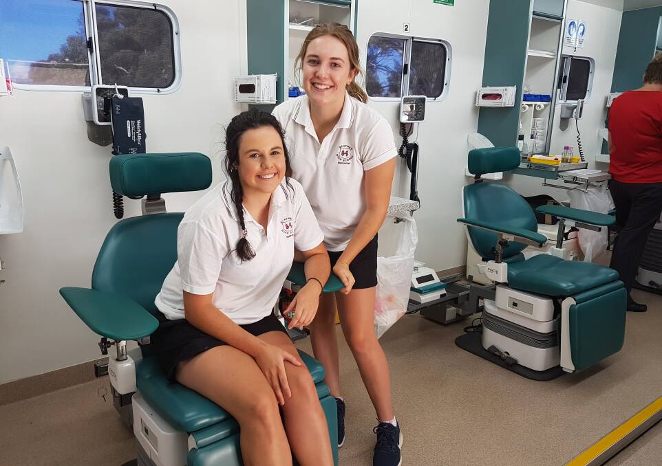 THREE LIVES: In 2017 Blayney High School year 12 students Madi Bullock and Trisha Parker were among those who gave blood. Photo: BLAYNEY HIGH SCHOOL
