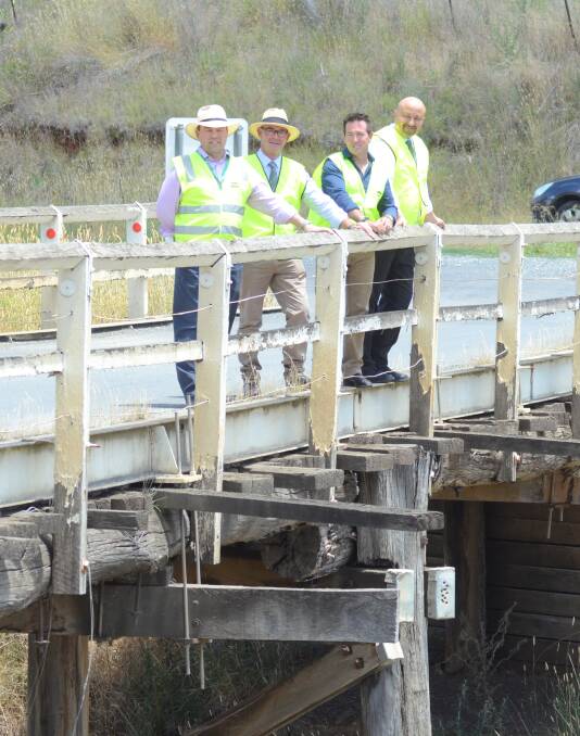 Straight and wide: Grant Baker, Allan Ewin, Paul Toole and Anton Franze at the soon to be improved Brown's Creek Bridge. Photo: Mark Logan.