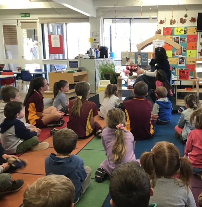 OUT THERE: Educator Rachelle Wilson reading Give me some Space! to Blayney PreSchool and St Joseph Students