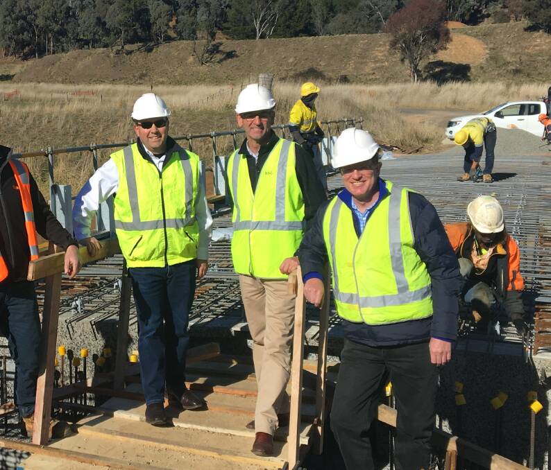 Shortcut: Grant Baker, Scott Ferguson and Andrew Gee inspect the construction of the new bridge on Felltimber Road near Carcoar – the first bridge to be rebuilt as part of the Blayney Shire Bridge Renewal Project.