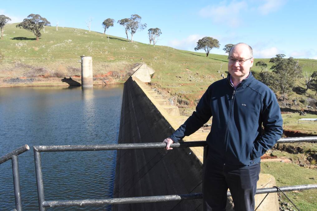 Build the wall: CTW general manager Gavin Rhodes at the Lake Rowlands dam wall that shows at the far end of the wall how high it can be extended. Photo: Mark Logan.