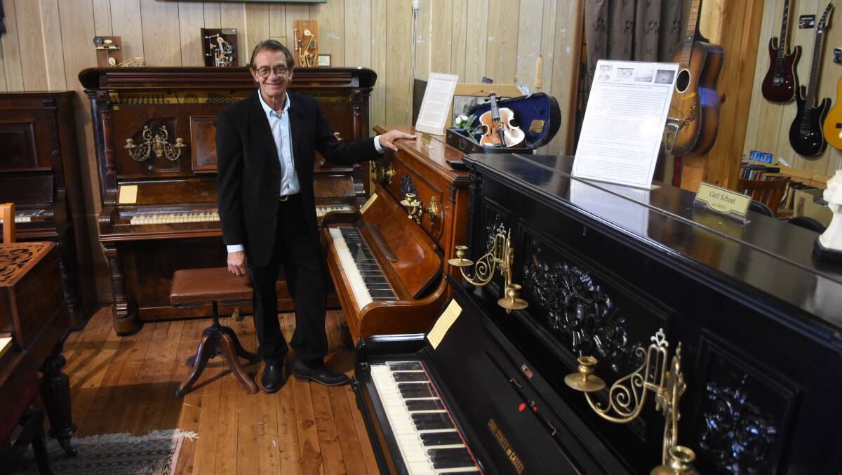 Carl's Corner: Surrounded by three different pianos by makers with Carl as their first name. 
