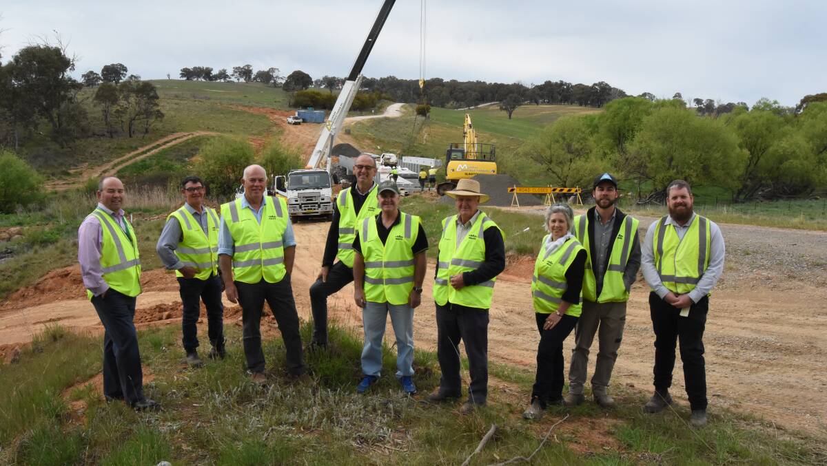 Beam me up: Blayney Shire Council staff and councillors watched on as a beam is lowered into place on the Cowriga Creek bridge. Photo: Mark Logan.