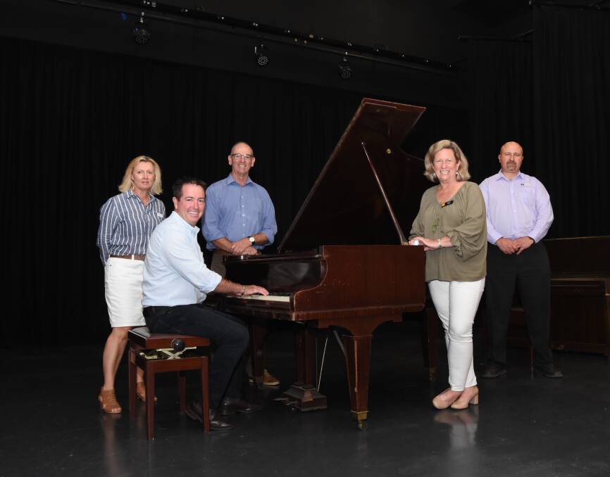 SING ME A SONG: Michelle Pryse Jones, Paul Toole, Scott Ferguson, Donna Riles and Anton Franze will be happily saying goodbye to the old grand piano in the community centre. Photo: Mark Logan.