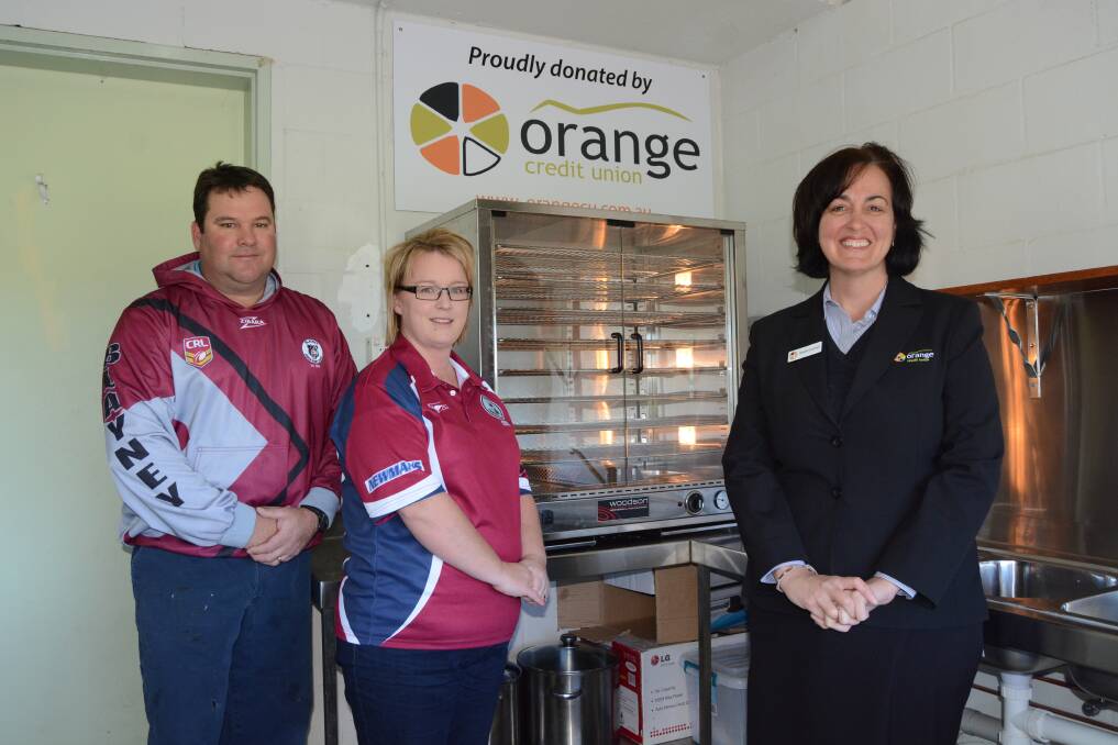 The heat is on: Mick Miskell, Justine Bevan and Noelle Cornish with the 220 capacity pie oven that was donated by Orange Credit Union. Photo: Mark Logan.