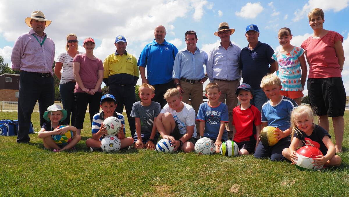 Rolling on: Paul Toole and Anton Franze (centre) with members of the Blayney Junior Soccer Club and representatives from Blayney Shire Council.