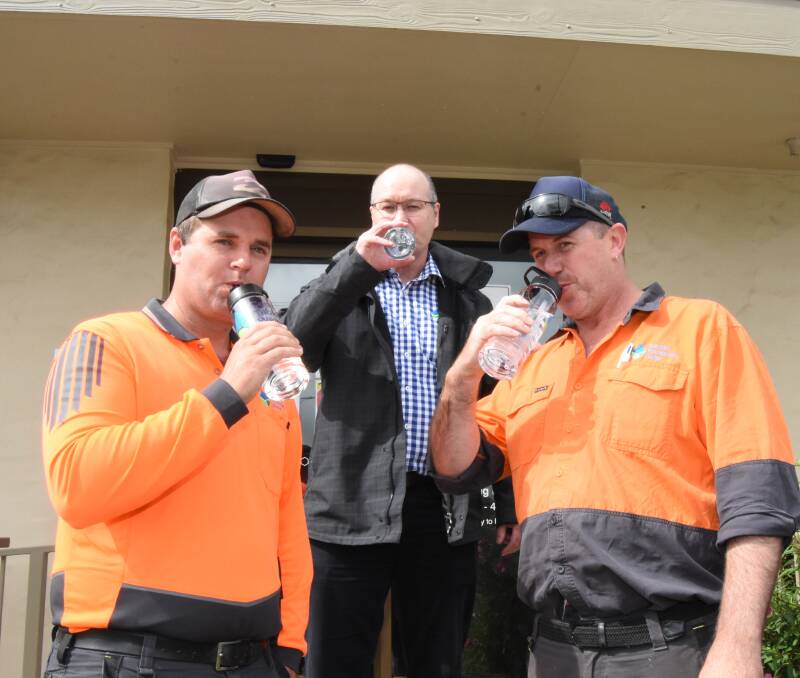 TASTE TEST: Water Quality Officers Joe Fuller and Corey Henry (front) with Gavin Rhodes taste a sample of Blayney's finest water. Photo: Mark Logan.