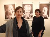 Kaelene Masters and Kelly Oxley at Platform Arts Hub with just a few of the images included in the exhibition. Photo: Mark Logan.