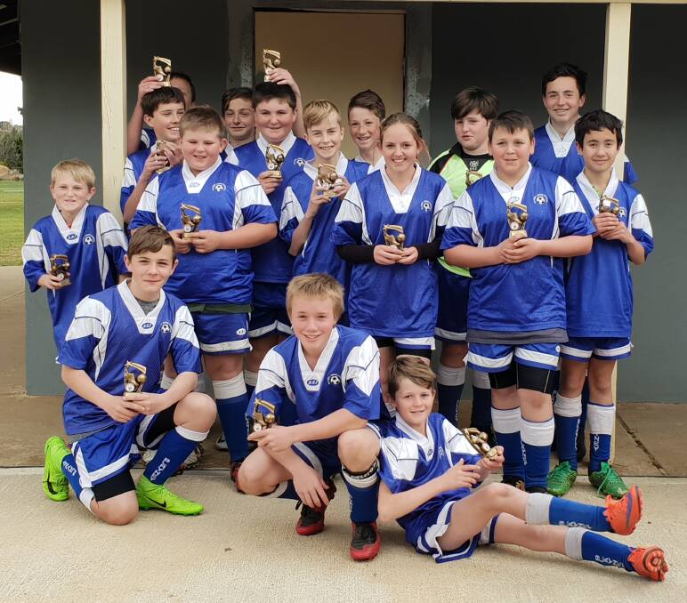 Happy champions: A well deserved win was had by the Blayney under 13's Tigers against CYMS last Saturday. Photo: Contributed.