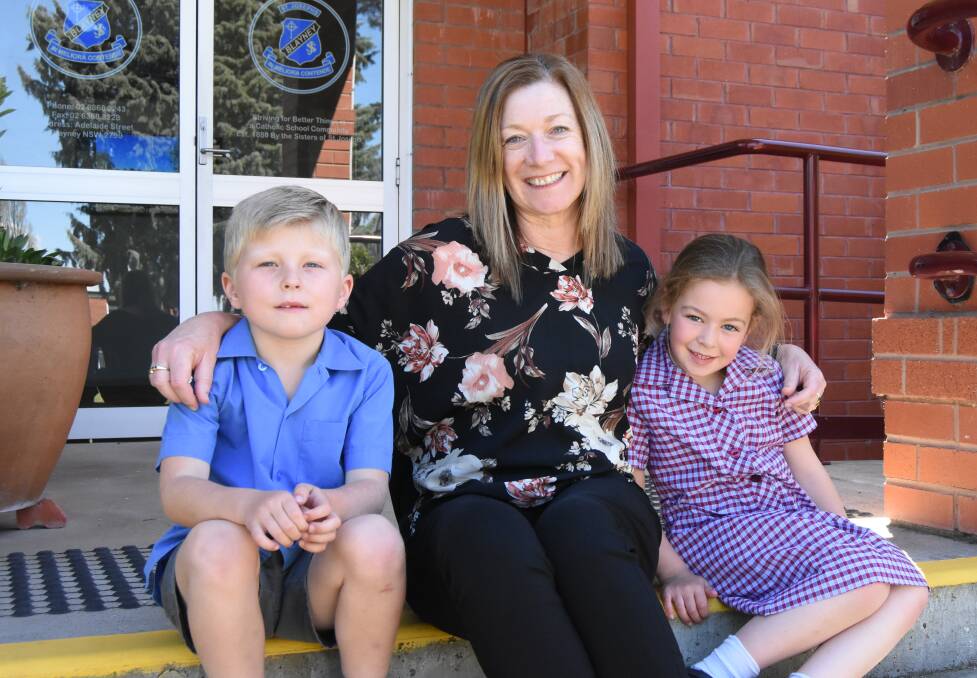Principal: Kerrie Basha, photographed here with students Joey and Madison, is taking on the role of principal at St Joseph's. Photo: Mark Logan.