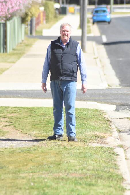 Paving the way: Councillor Bruce Reynolds at the site of the missing footpath link on Binstead Street. Photo: Mark Logan.