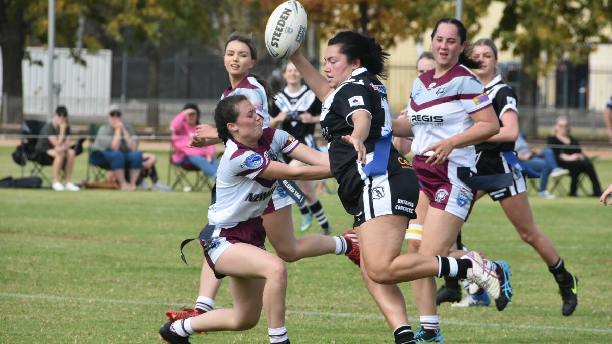 Cowra League Tag captain coach Stacey Ashe tries to pass Abby Stammers' defence.