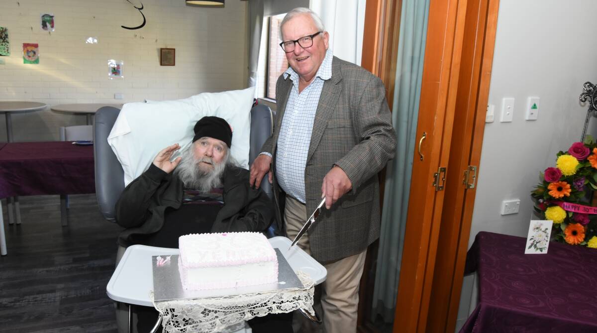 Longest serving resident Wayne Seberry with the chairman of the Lee Hostel Committee Miles Hedge during the hostel's 30th birthday celebrations last year. Photo: Mark Logan