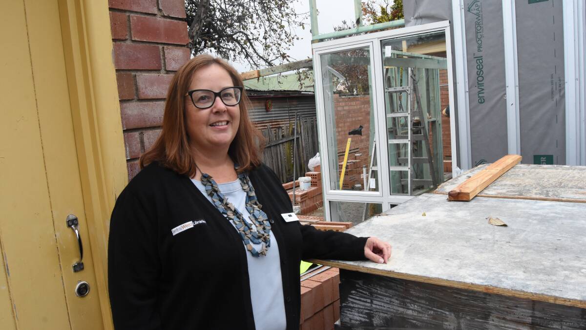 LONG WAIT: Librarian Ruth Bingham is keen to end the trips to the outhouse when the new toilets at the library are finished. Photo: Mark Logan.