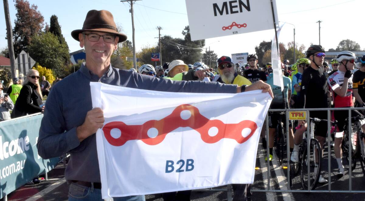 Ride on: Scott Ferguson waving the flag for Blayney at the 2018 B2B starting line. 