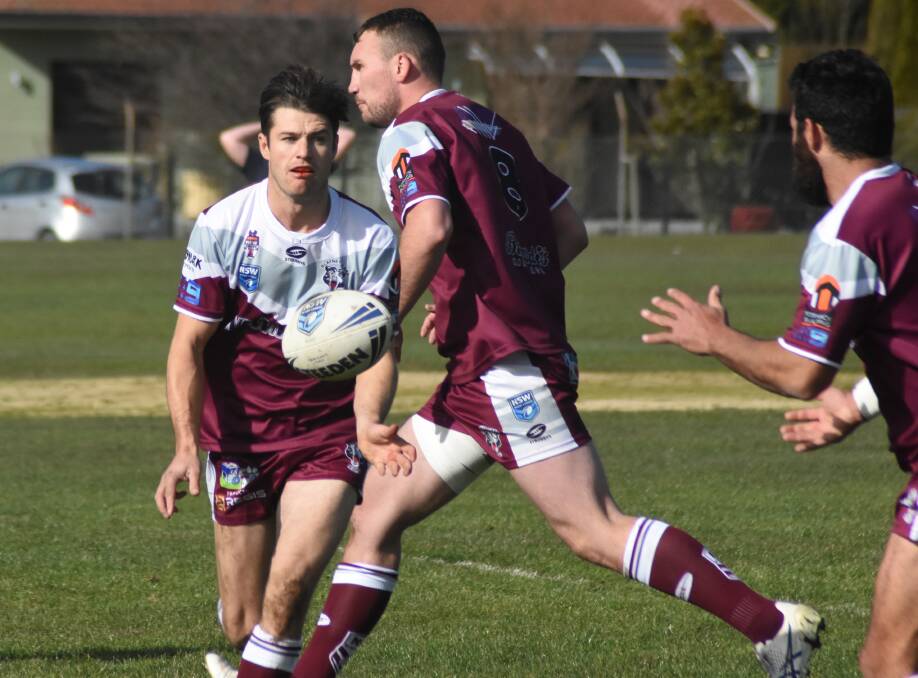 Jesse Nixon gets the ball away to Alex Pettit at King George Oval. This Sunday's match is the last home game for the Blayney Bears.