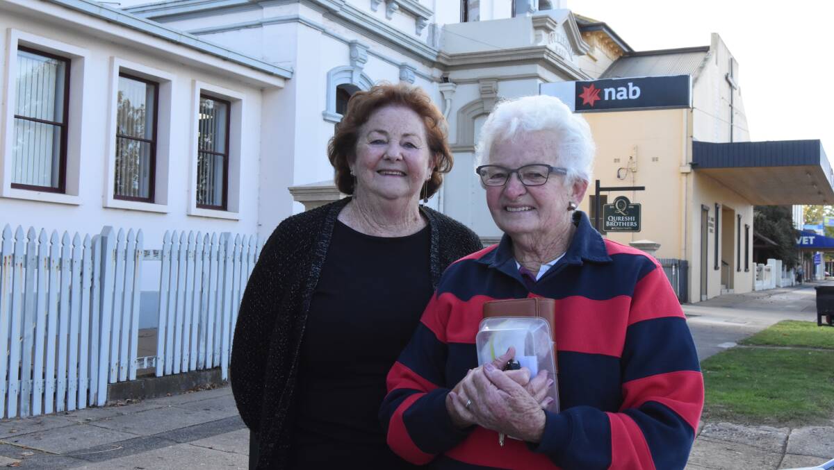 DISAPPOINTED: Heather Cox and Judy Newstead are two of the last customers in the Blayney branch of the NAB. Photo: Mark Logan.