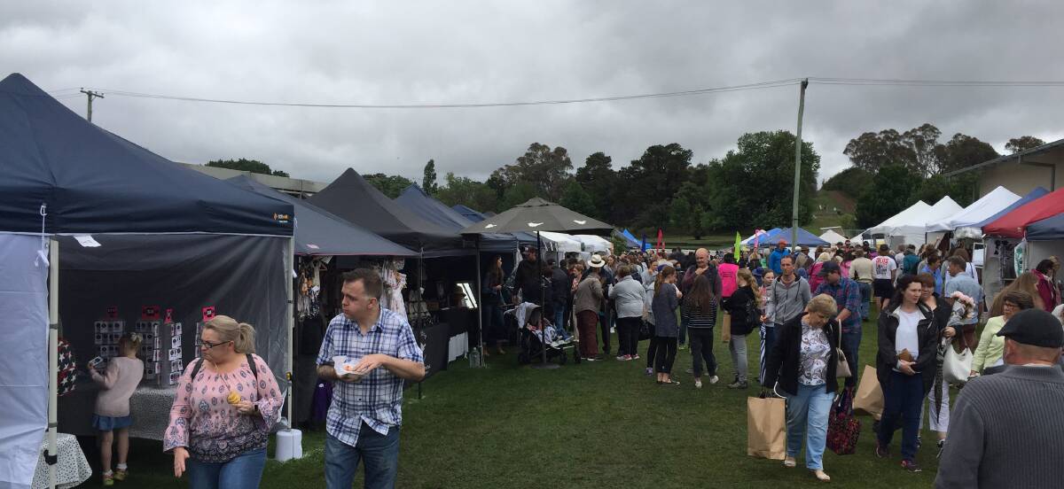 No deterrent: Ominous clouds and damp conditions failed to repel the fans of the Millthorpe Markets. The next market is on Sunday, April 8. Photo Mark Logan.