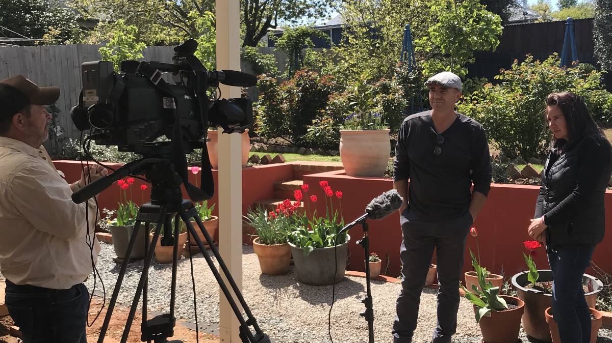 That's a wrap: Brendan Cooper filming Arthur and Melissa Rudman in their Millthorpe garden. Photo: Contributed.