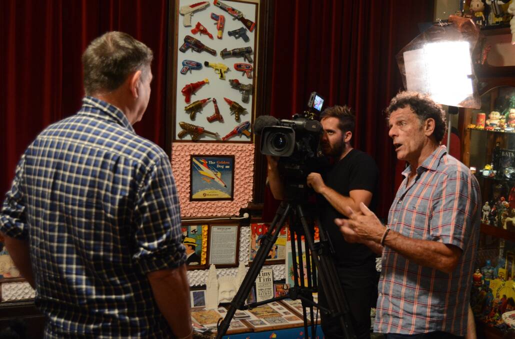 Cutaway: Mike Whitney and his film crew interview the owner of the Carcoar Toy Museum, Warwick Powell for an upcoming episode of Sydney Weekender. Photo: Mark Logan